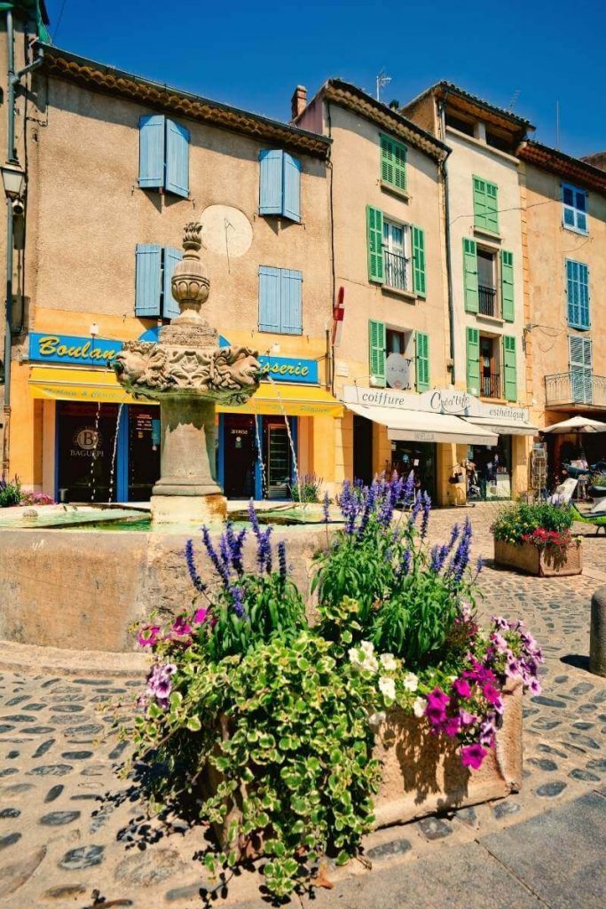 Valensole fountain and medieval buildings