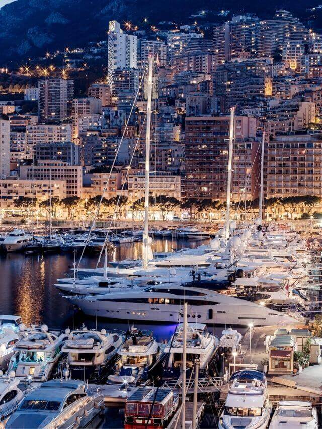 Port of Monaco at night lighted with the buildings in the South of France in October