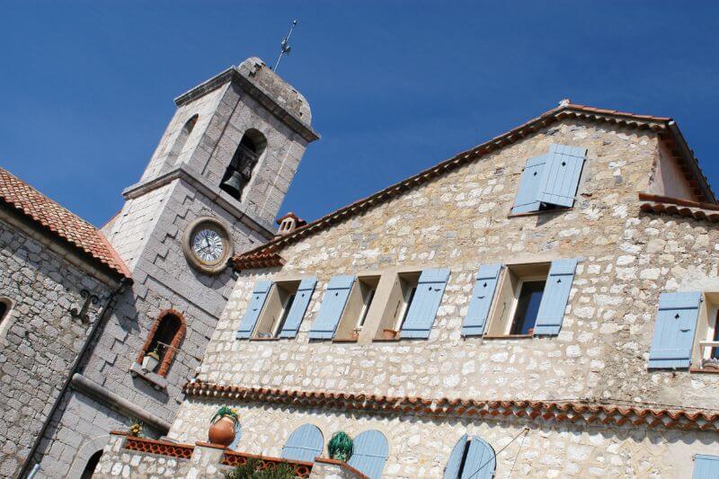 Church in Gourdon with blue sky