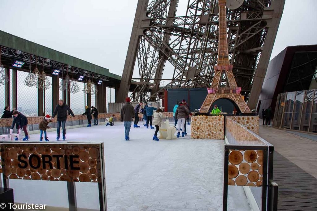 Skating rink in winter in Paris France's Eiffel Tower with people