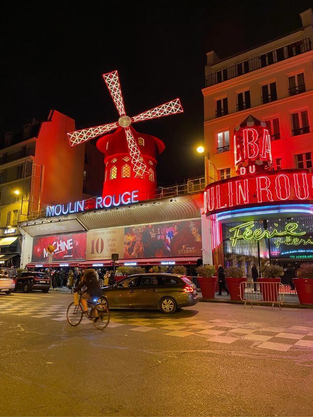 Moulin Rouge at night during an early Paris in winter