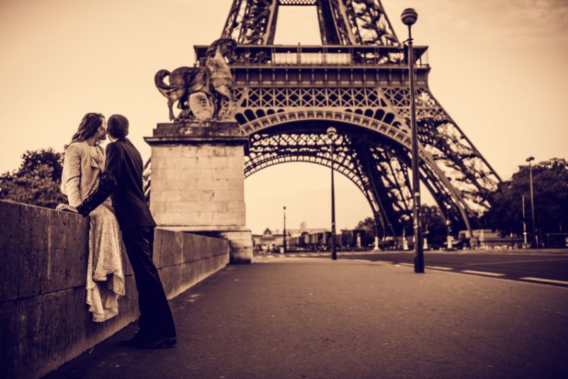 Couple in sepia at Eiffel Tower