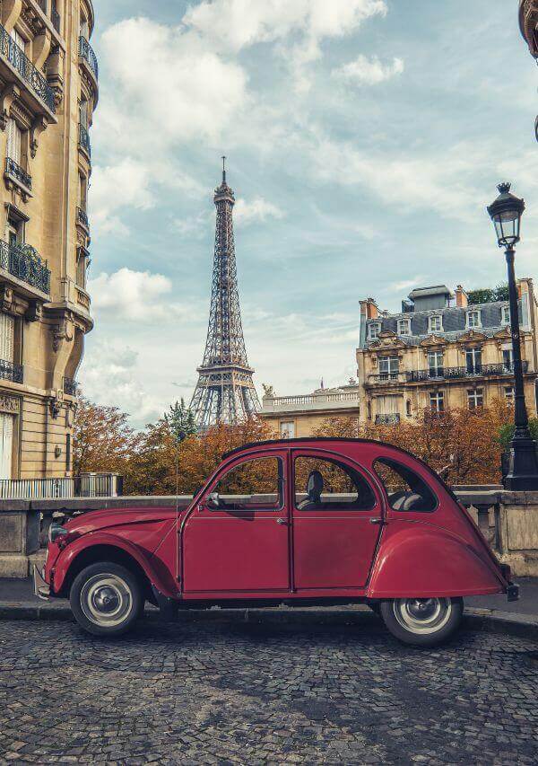 Antique Citroen red Eiffel Tower background
