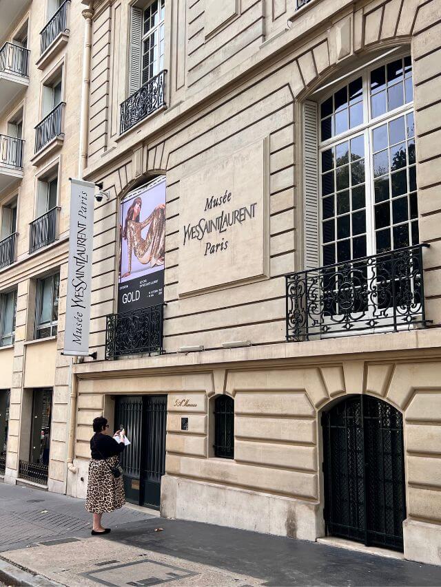  A person standing outside the Musée Yves Saint Laurent, one of the best fashion museums in paris