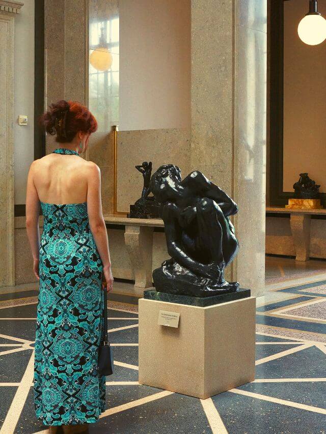 Woman in green dress in museum