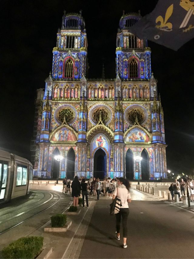 Orleans Cathedral at night with illuminations on the facade