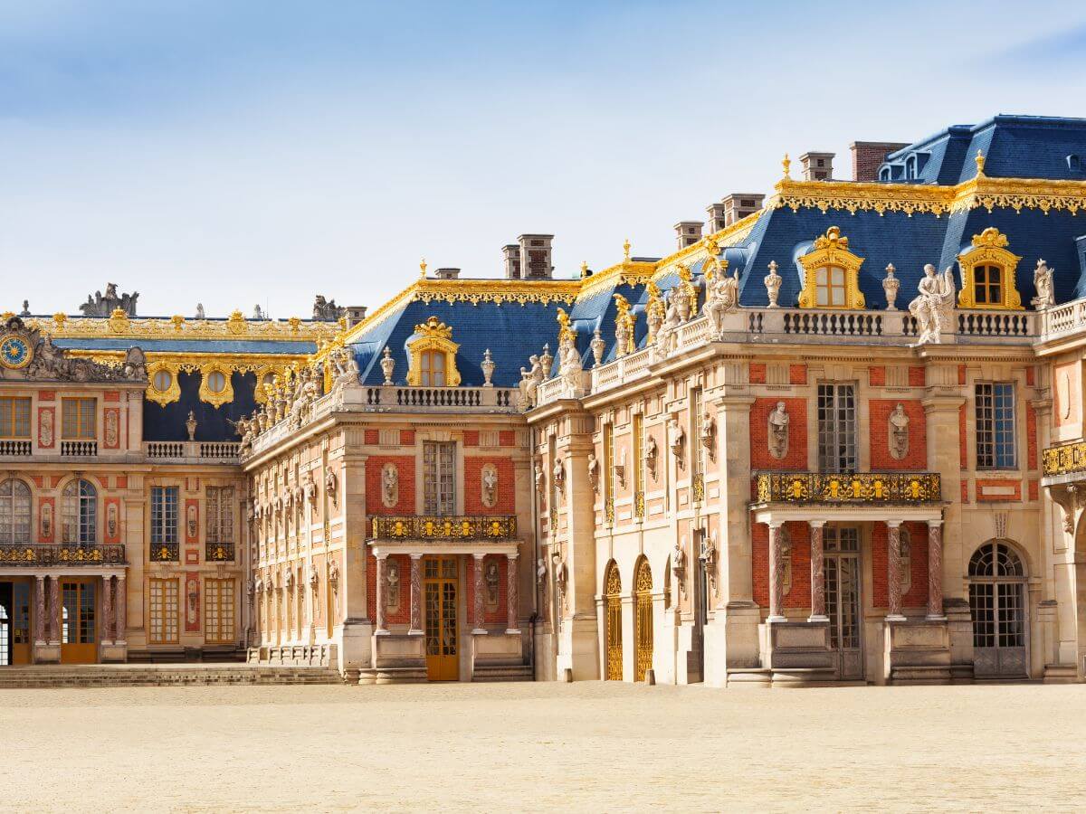 the Palace of Versailles under blue skies with during September in Paris