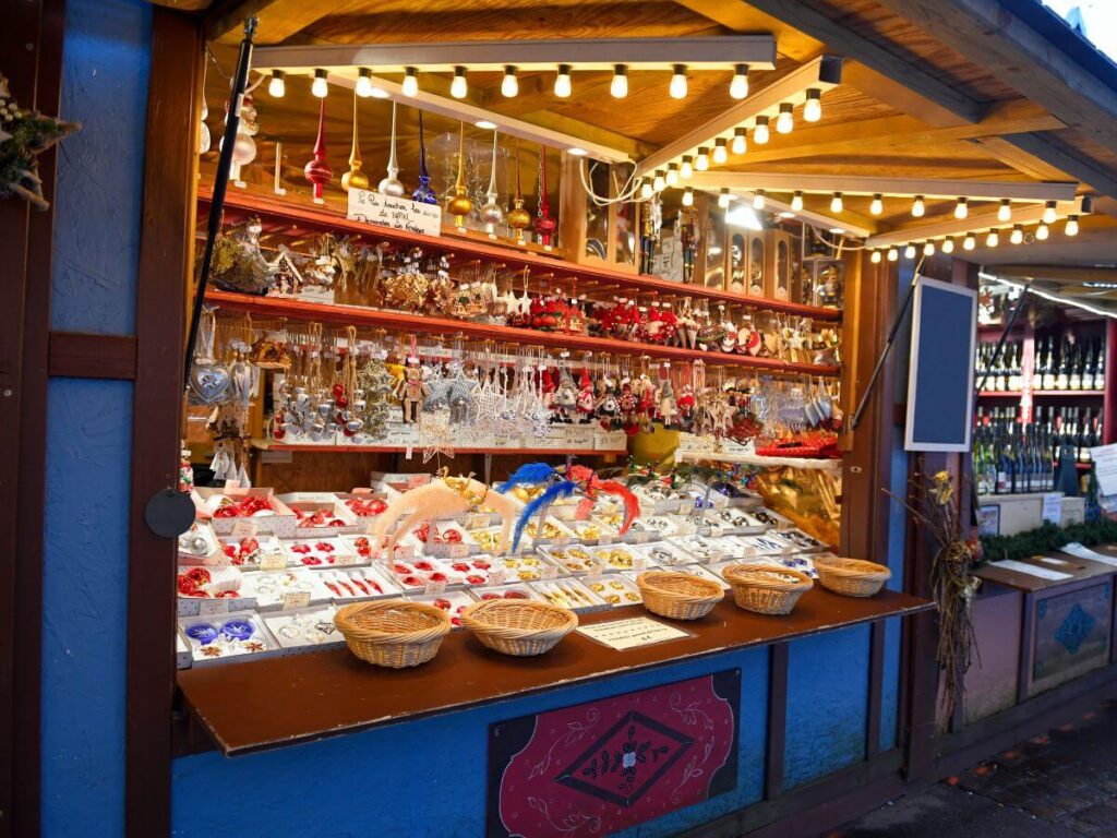 A display of snacks and wines at the Christmas markets in Colmar, one of the top places to visit in Winter in France