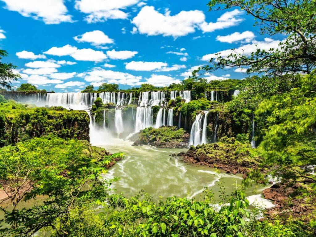 The Iguazu Falls surrounded by lush vegetation in Argentina, a country eligible in ETIAS Europe