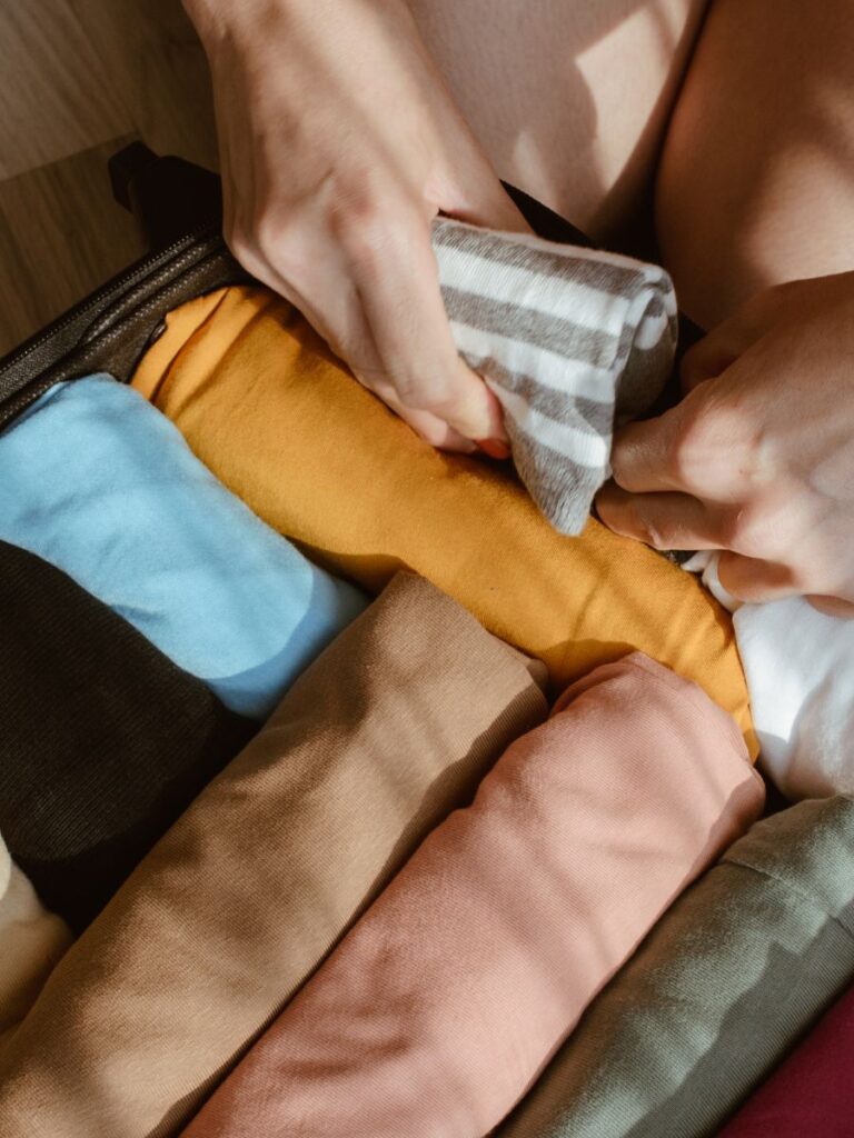 Packing rolling clothes, one of the best ways to keep every item from the Paris packing list